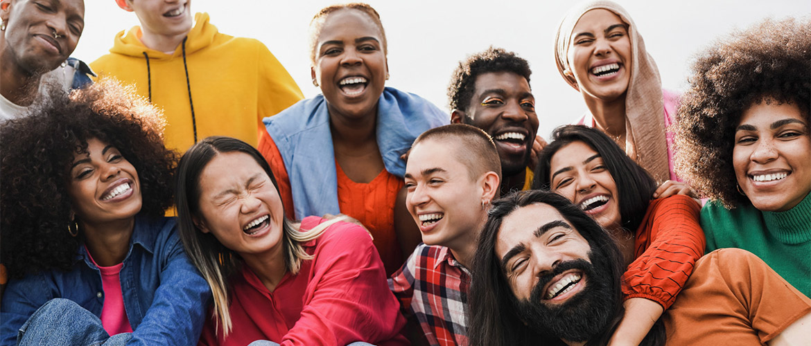 A diverse group of young people smiling and laughing