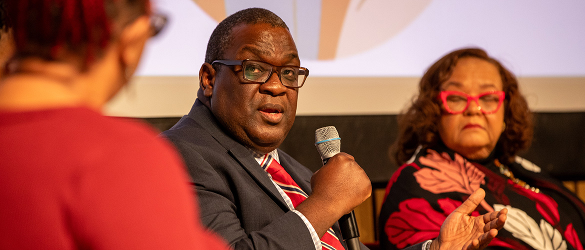 Dr. Dami Adeyemi, a medical director for Blue Cross and Blue Shield of Illnois, speaks during a panel discussion